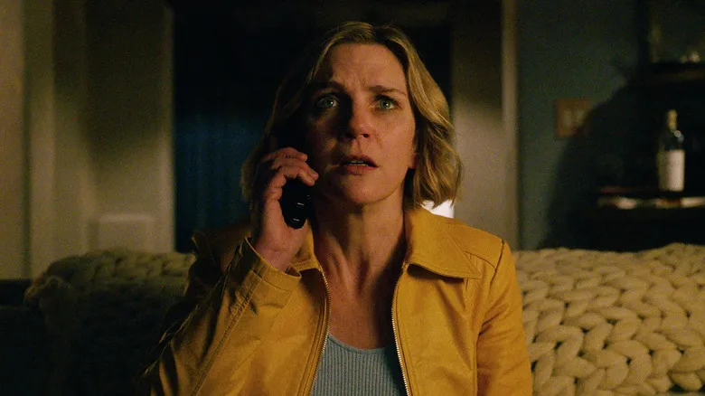 Carol on the phone looking alarmed in Pluribus